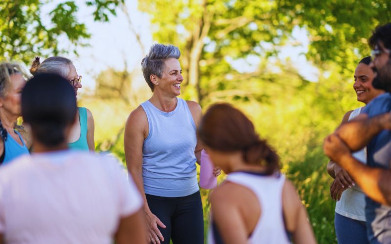 a group of people exercising and living an active happy life - remedial massage services can help reduce pain and improve mobility | Glenn Kinder massage Therapy Melbourne